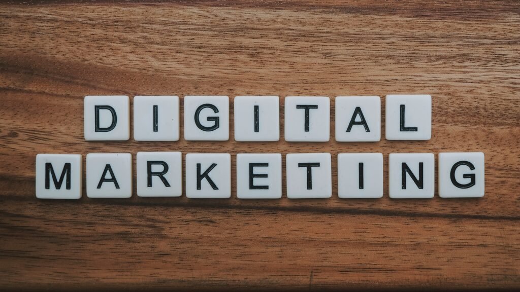 Scrabble-style letter tiles spelling out 'Digital Marketing' arranged on a wooden surface